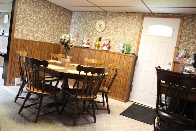 243 Courtland Ave, Waterbury, CT 06705 - dining area featuring a drop ceiling, wainscoting, and wooden walls