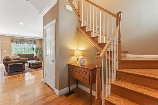 74 Avery Ave, Meriden, CT 06450 - staircase featuring baseboards, wood finished floors, ornamental molding, and recessed lighting