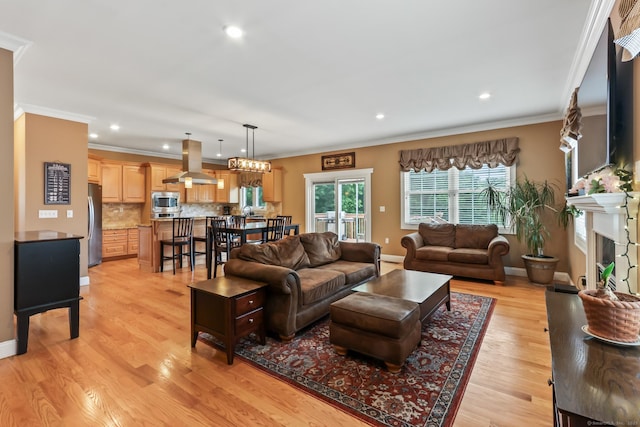 74 Avery Ave, Meriden, CT 06450 - living area with ornamental molding, light wood-style flooring, baseboards, recessed lighting, and a fireplace