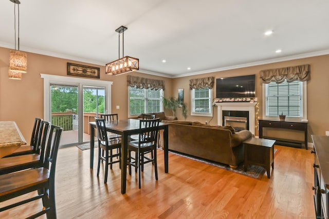 74 Avery Ave, Meriden, CT 06450 - dining room featuring ornamental molding, light wood-style flooring, recessed lighting, and a fireplace