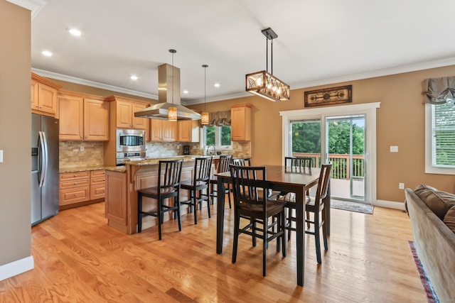 74 Avery Ave, Meriden, CT 06450 - dining room with ornamental molding, light wood-style floors, recessed lighting, and baseboards