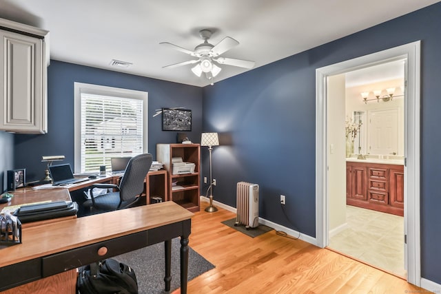 74 Avery Ave, Meriden, CT 06450 - office area featuring radiator heating unit, ceiling fan, light wood finished floors, and baseboards
