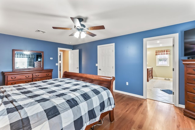 74 Avery Ave, Meriden, CT 06450 - bedroom with wood finished floors, baseboards, ceiling fan, and connected bathroom