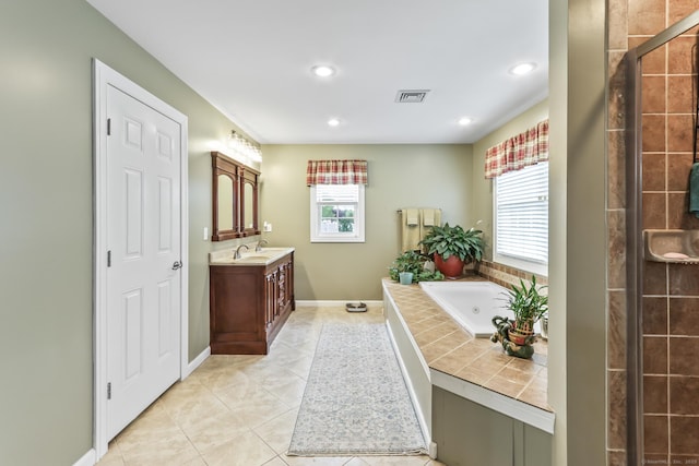 74 Avery Ave, Meriden, CT 06450 - bathroom featuring vanity, a whirlpool tub, tile patterned floors, recessed lighting, and tiled shower