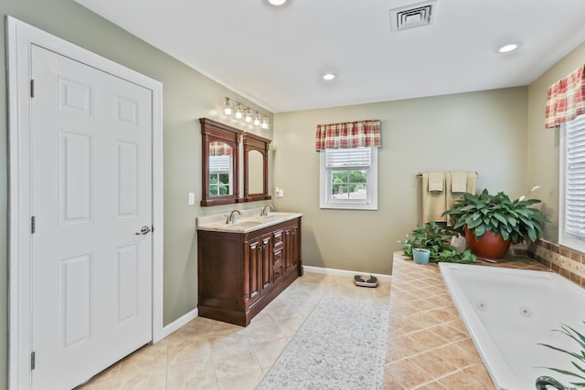 74 Avery Ave, Meriden, CT 06450 - bathroom featuring vanity, a whirlpool tub, recessed lighting, baseboards, and tile patterned flooring
