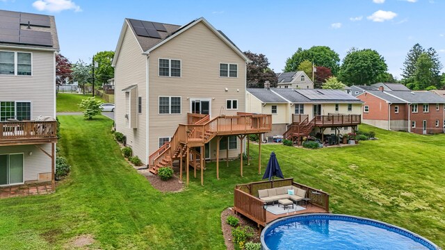 74 Avery Ave, Meriden, CT 06450 - rear view of house featuring stairs, a wooden deck, an outdoor living space, a yard, and a residential view