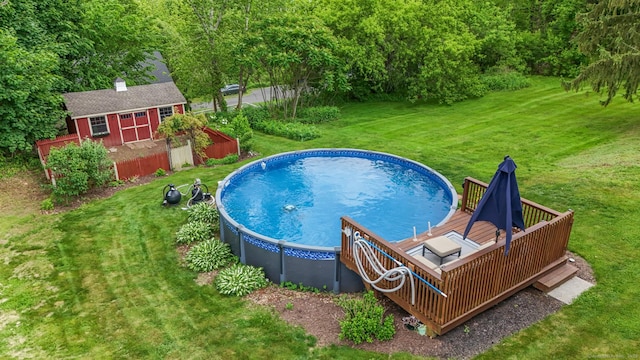 74 Avery Ave, Meriden, CT 06450 - view of swimming pool with an outdoor structure, a yard, and a wooden deck