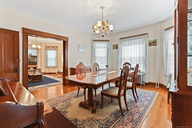 30 Newton St, Hartford, CT 06106 - dining room featuring a chandelier and light wood-style flooring
