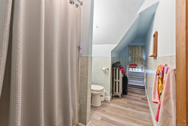 30 Newton St, Hartford, CT 06106 - bathroom featuring tile walls, wood finished floors, toilet, radiator, and curtained shower