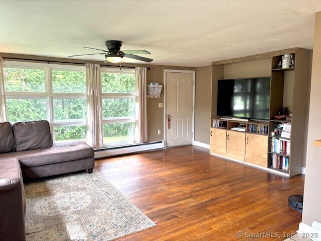 127 Stockhouse Rd, Bozrah, CT 06334 - living area with a baseboard heating unit, a ceiling fan, wood finished floors, and baseboards