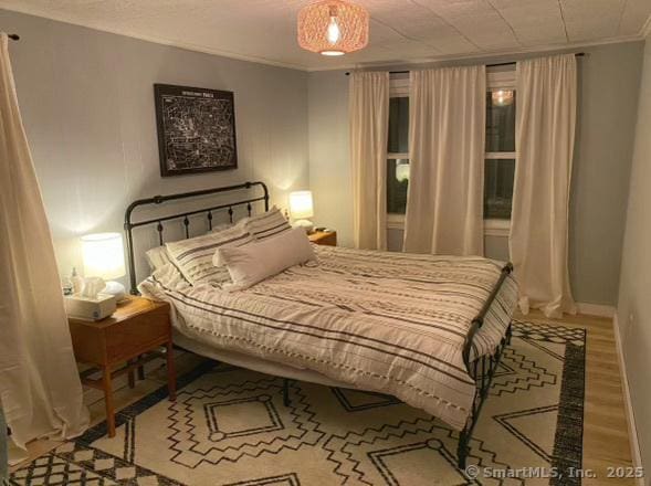 2 Dilliston Rd, Barkhamsted, CT 06063 - bedroom featuring ornamental molding, wood finished floors, and baseboards