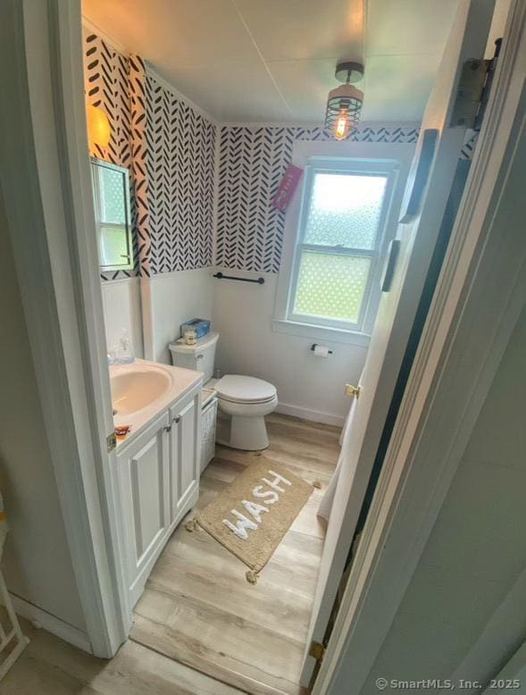 2 Dilliston Rd, Barkhamsted, CT 06063 - bathroom with vanity, toilet, wood finished floors, baseboards, and wallpapered walls