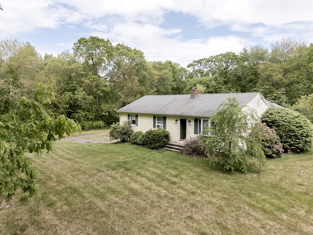 104 E St, Hebron, CT 06248 - view of front of home with a front yard, a chimney, and a shingled roof
