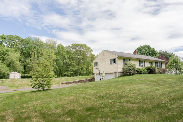 104 E St, Hebron, CT 06248 - view of green lawn featuring a garage