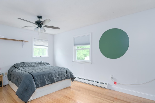 104 E St, Hebron, CT 06248 - bedroom featuring baseboard heating, multiple windows, and wood-type flooring