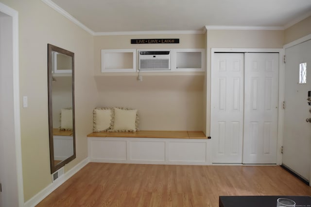 40 Mountainville Rd, Danbury, CT 06810 - foyer with wood finished floors, a wall mounted AC, and ornamental molding