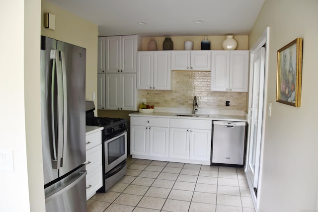 40 Mountainville Rd, Danbury, CT 06810 - kitchen with stainless steel appliances, a sink, light countertops, white cabinetry, and light tile patterned floors