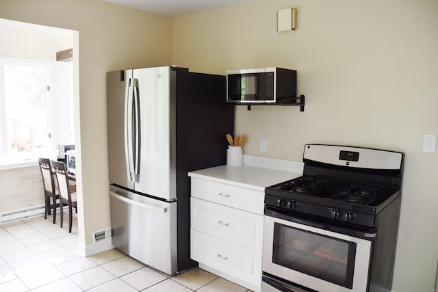 40 Mountainville Rd, Danbury, CT 06810 - kitchen featuring appliances with stainless steel finishes, light countertops, white cabinetry, and light tile patterned flooring
