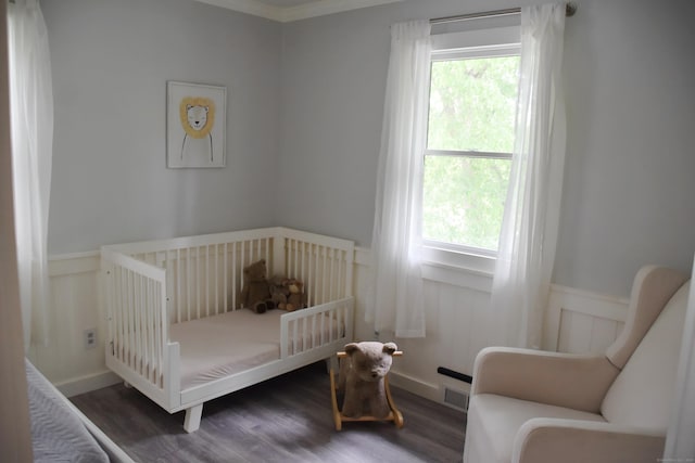 40 Mountainville Rd, Danbury, CT 06810 - bedroom featuring wood finished floors, a nursery area, and a wainscoted wall