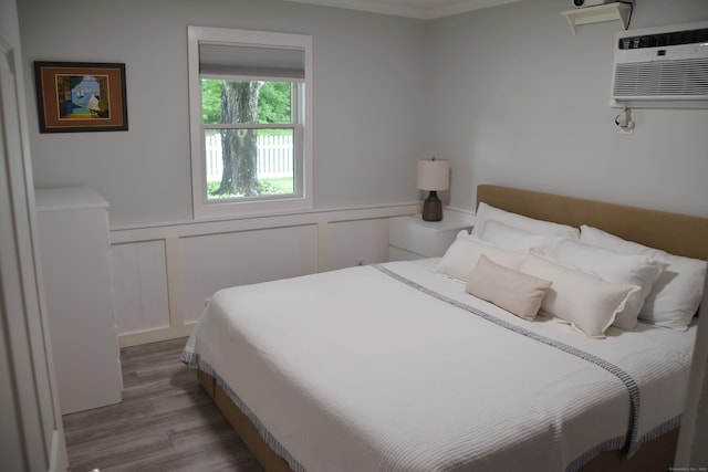 40 Mountainville Rd, Danbury, CT 06810 - bedroom featuring wood finished floors, wainscoting, a decorative wall, a wall mounted air conditioner, and crown molding