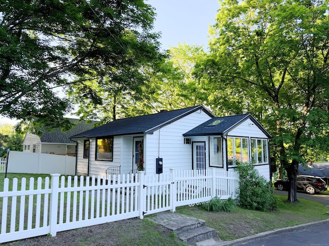 40 Mountainville Rd, Danbury, CT 06810 - view of front of house featuring a shingled roof, a fenced front yard, and a sunroom