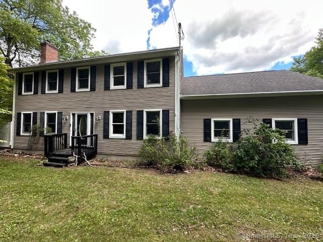 149 Mill Hill Rd, Colchester, CT 06415 - colonial house featuring a chimney and a front lawn