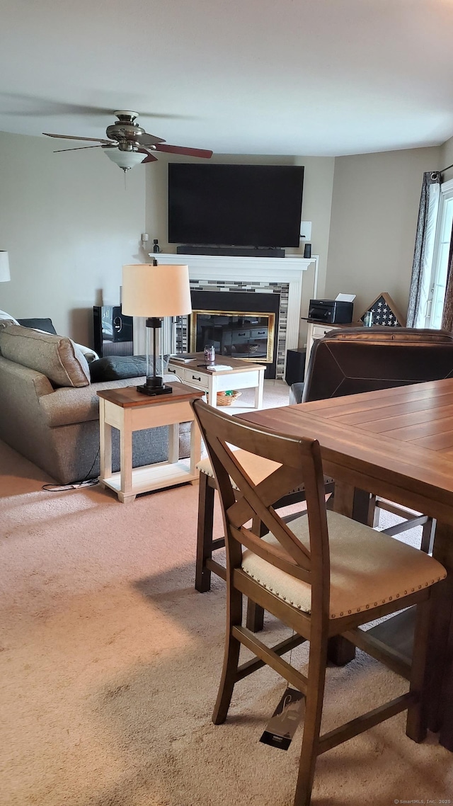 71 Leafwood Ln Unit 294, Groton, CT 06340 - carpeted dining space with a tiled fireplace and a ceiling fan