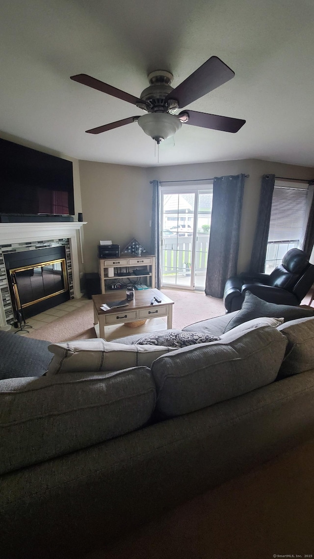 71 Leafwood Ln Unit 294, Groton, CT 06340 - living area with carpet flooring, a tile fireplace, healthy amount of natural light, and ceiling fan