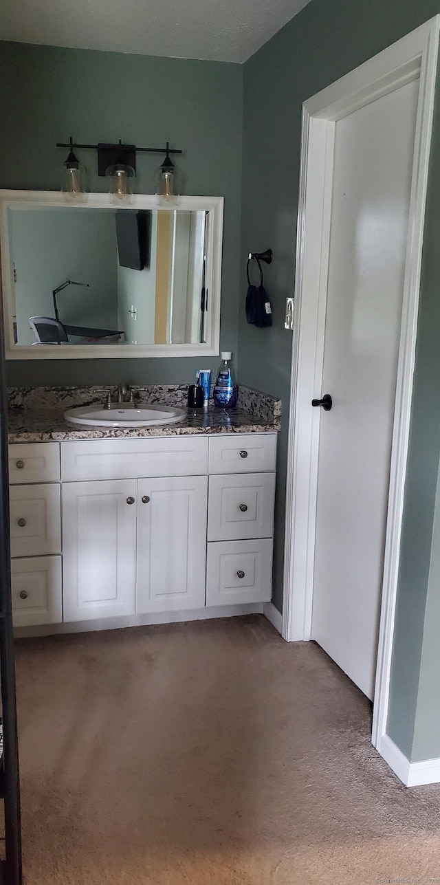71 Leafwood Ln Unit 294, Groton, CT 06340 - bathroom featuring vanity and baseboards