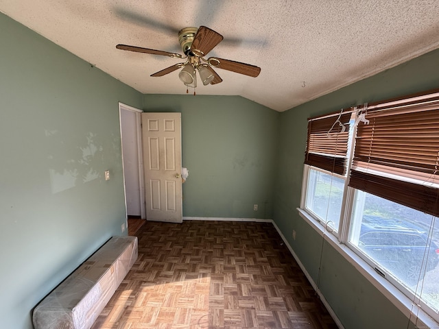 81 Melrose Dr, New Haven, CT 06513 - unfurnished room with a textured ceiling, a ceiling fan, lofted ceiling, and baseboards