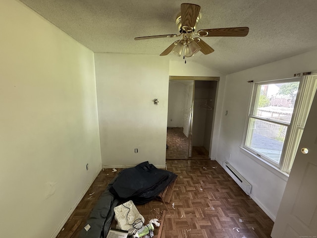 81 Melrose Dr, New Haven, CT 06513 - empty room featuring a baseboard heating unit, lofted ceiling, a textured ceiling, baseboards, and ceiling fan