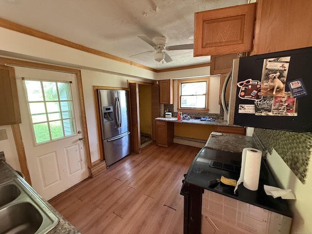 81 Melrose Dr, New Haven, CT 06513 - kitchen with stainless steel refrigerator with ice dispenser, light wood-style floors, ceiling fan, refrigerator, and brown cabinets
