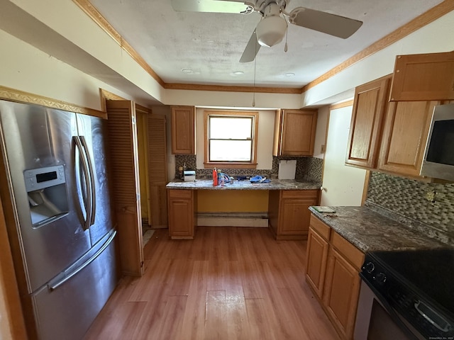 81 Melrose Dr, New Haven, CT 06513 - kitchen featuring appliances with stainless steel finishes, a baseboard radiator, light wood-type flooring, backsplash, and a ceiling fan