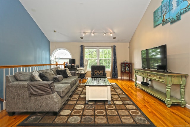 354 Lynne Pl, Bridgeport, CT 06610 - living area with wood finished floors, track lighting, and high vaulted ceiling