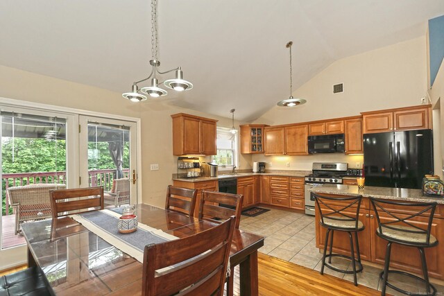 354 Lynne Pl, Bridgeport, CT 06610 - dining room featuring a chandelier and high vaulted ceiling