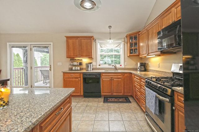 354 Lynne Pl, Bridgeport, CT 06610 - kitchen with black appliances, a sink, brown cabinetry, and light stone counters