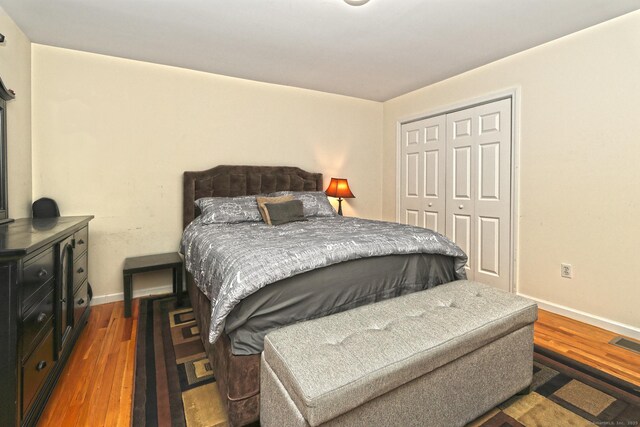 354 Lynne Pl, Bridgeport, CT 06610 - bedroom with wood finished floors, a closet, and baseboards