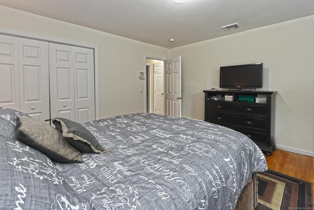 354 Lynne Pl, Bridgeport, CT 06610 - bedroom with wood finished floors, a closet, and baseboards