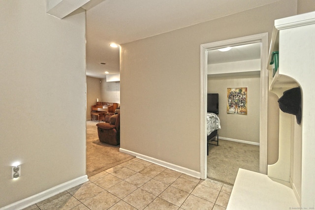 354 Lynne Pl, Bridgeport, CT 06610 - hallway featuring light carpet, light tile patterned flooring, baseboards, and recessed lighting