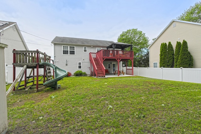 354 Lynne Pl, Bridgeport, CT 06610 - back of house with a patio, a playground, a wooden deck, and stairs