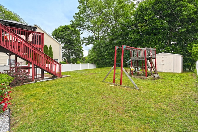 354 Lynne Pl, Bridgeport, CT 06610 - view of yard with stairs, a wooden deck, and a playground