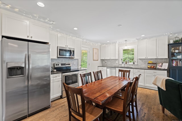 72 Twin Brook Ter, Monroe, CT 06468 - dining space with light wood finished floors and recessed lighting