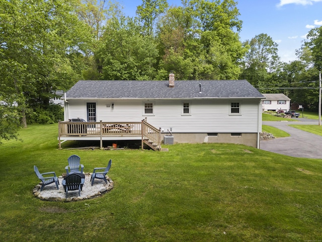 72 Twin Brook Ter, Monroe, CT 06468 - rear view of house with a fire pit, a wooden deck, a yard, and roof with shingles