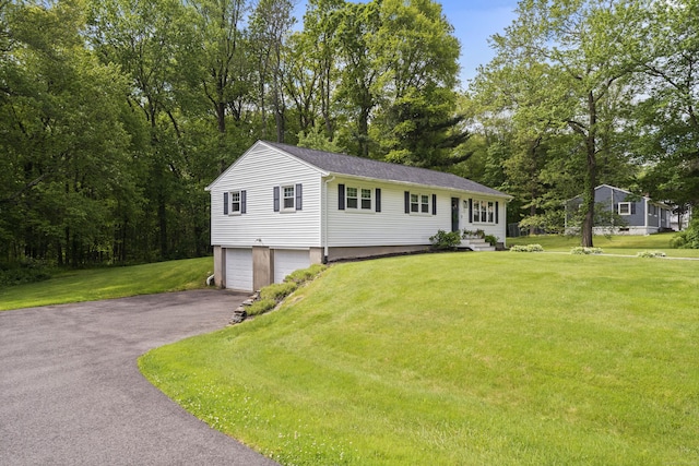 72 Twin Brook Ter, Monroe, CT 06468 - view of front facade with asphalt driveway, an attached garage, and a front lawn