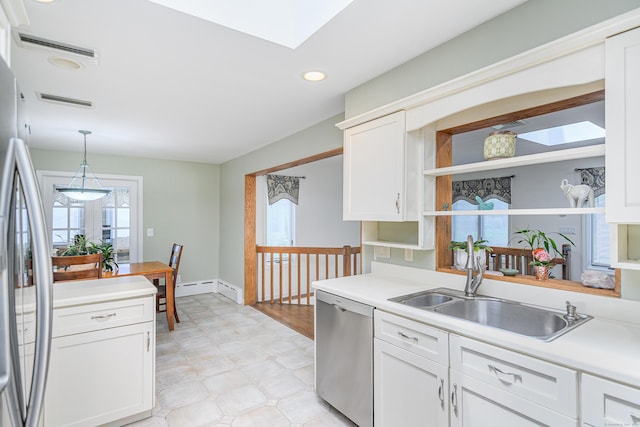 28 Sherry Ln, Danbury, CT 06811 - kitchen featuring appliances with stainless steel finishes, light floors, a sink, open shelves, and light countertops
