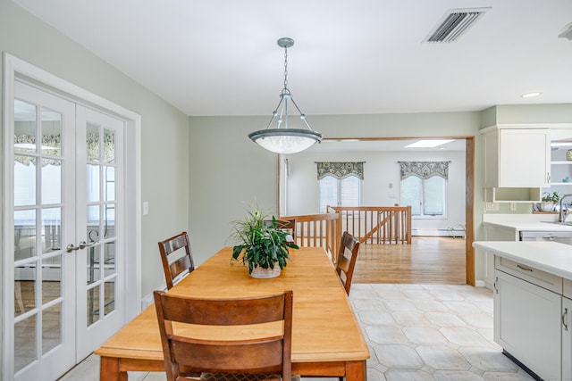 28 Sherry Ln, Danbury, CT 06811 - dining space with french doors, recessed lighting, and a baseboard heating unit