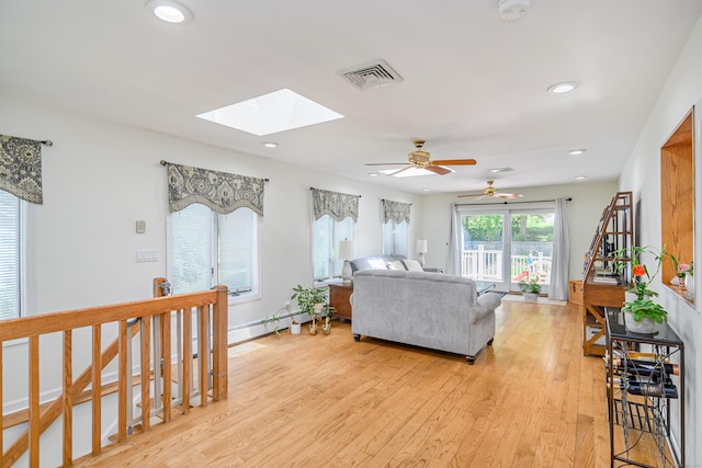 28 Sherry Ln, Danbury, CT 06811 - living area featuring a skylight, light wood finished floors, recessed lighting, a ceiling fan, and baseboard heating