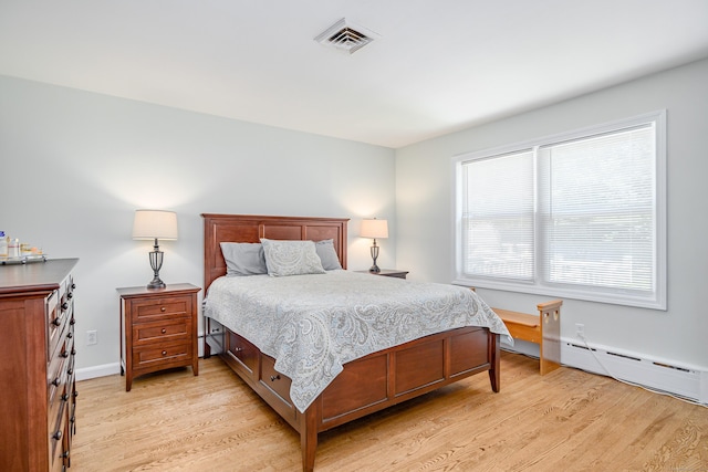 28 Sherry Ln, Danbury, CT 06811 - bedroom featuring light wood-type flooring, a baseboard heating unit, and baseboards