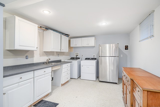 28 Sherry Ln, Danbury, CT 06811 - kitchen featuring freestanding refrigerator, washer and clothes dryer, white cabinetry, light floors, and recessed lighting