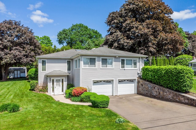 28 Sherry Ln, Danbury, CT 06811 - view of front of property with driveway, a front yard, a garage, roof with shingles, and a chimney